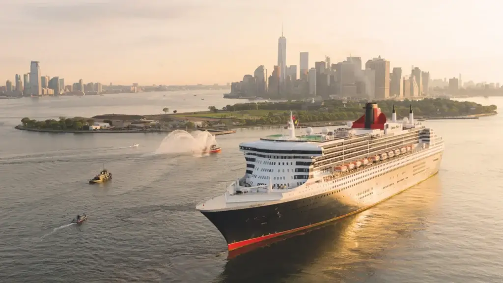 Cunard ocean liner sailing past the New York City skyline