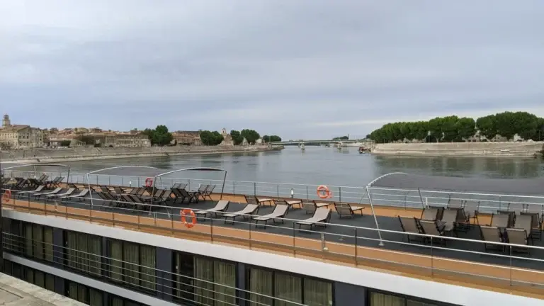 View from a river ship's top deck toward a riverside town