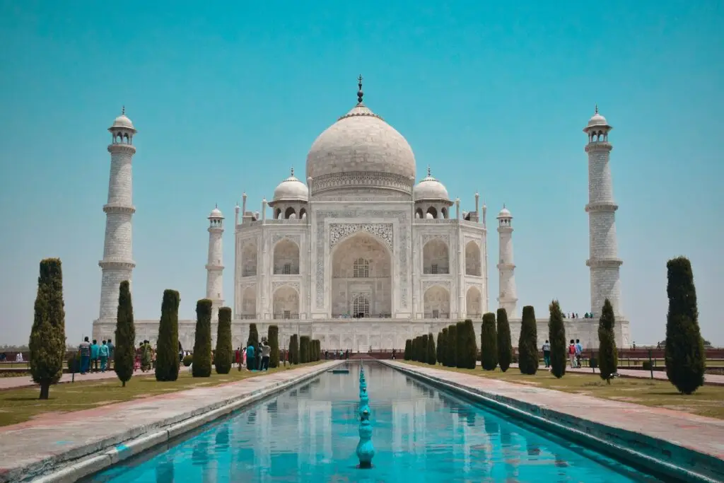 The Taj Mahal reflected in its garden pools, Agra, India