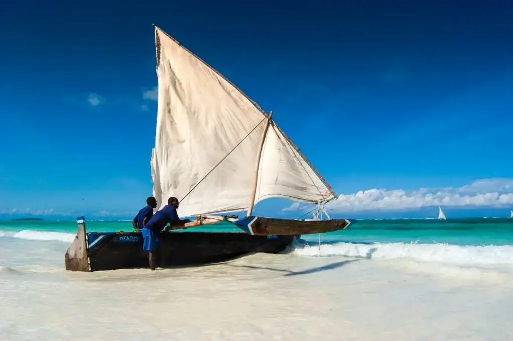 Dhow on a white-sand beach in Zanzibar, Tanzania